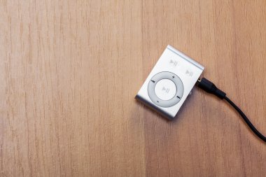 silver mp3 player on the table clipart