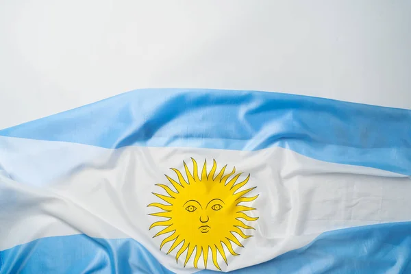 Fotografie vlající vlajky Argentiny ležící na povrchu — Stock fotografie