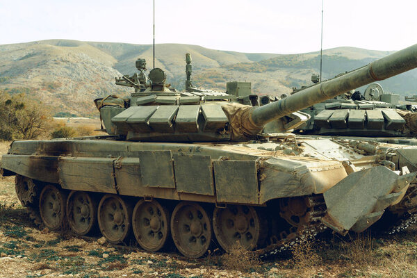 Russian battle tanks at tankodrome in mountains