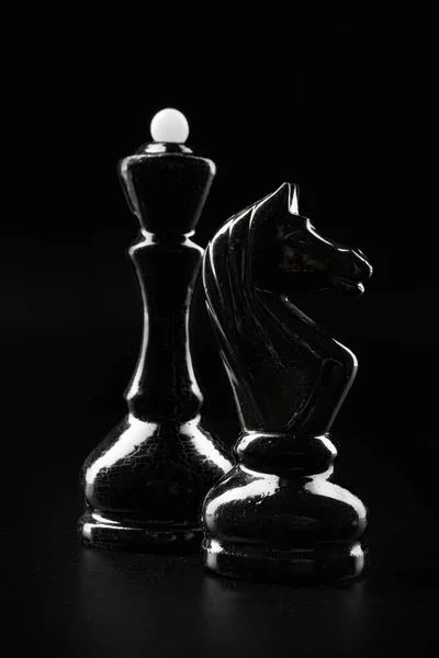 Chess figures on dark black background close up — Stock Photo, Image