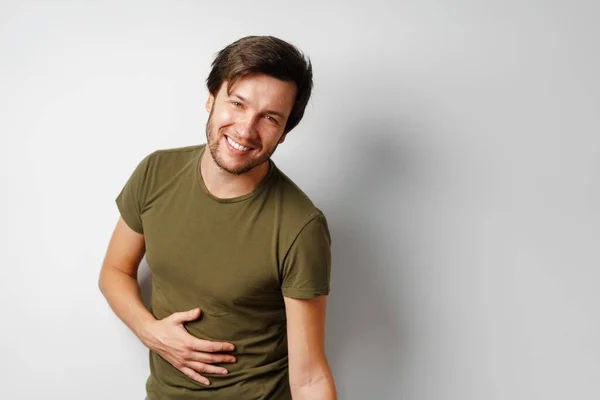 Handsome young man portrait smiling against grey background — Stock Photo, Image