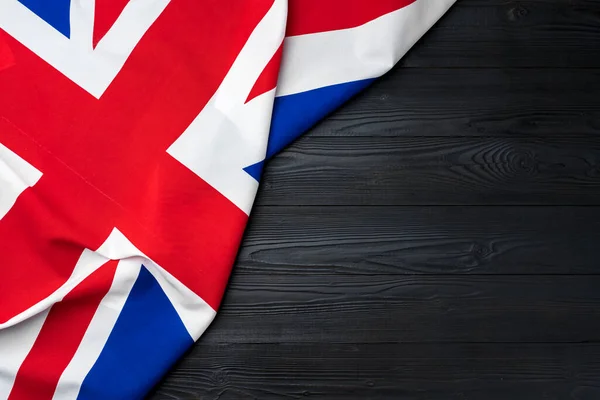 Bandera del Reino Unido sobre fondo de madera — Foto de Stock