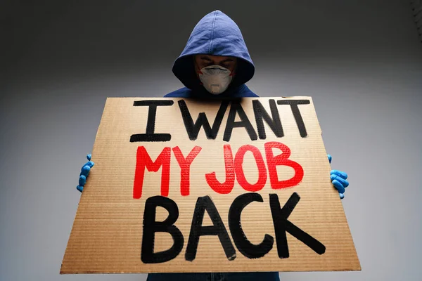 Placard I want my job back in hands of protester man wearing mask — Stock Photo, Image