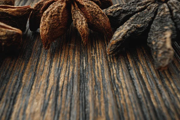 Macro photo of anise stars on wooden background — Stock Photo, Image