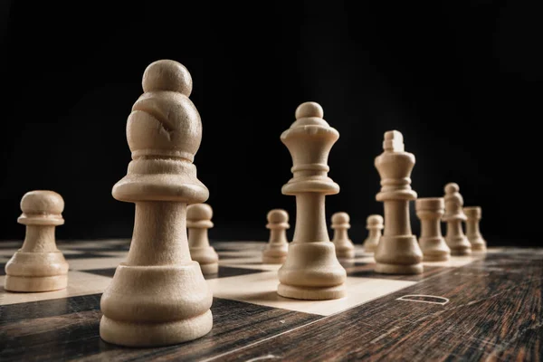 Macro shot of wooden chess figures on board — Stock Photo, Image