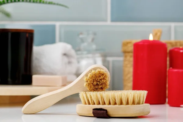 Wooden massage body brush in the bathroom