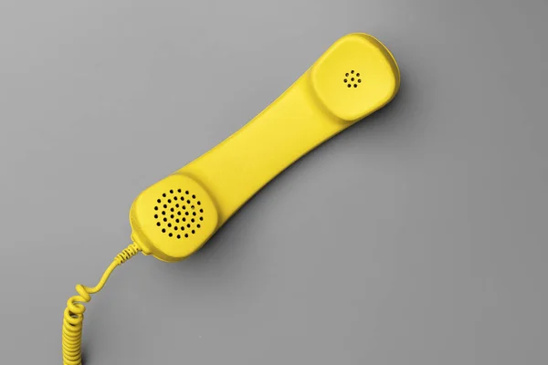 黄色.landline phone on gray background top view — 图库照片