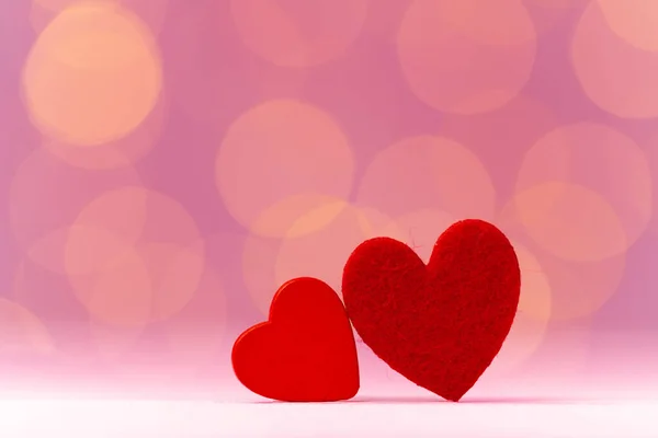 Red heart decoration against pink bokeh background — Stock Photo, Image