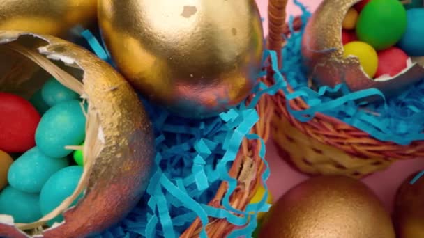 Easter egg with colorful candies in a basket close up