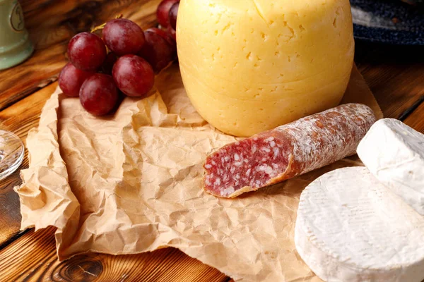 Head of cheese on brown wooden table