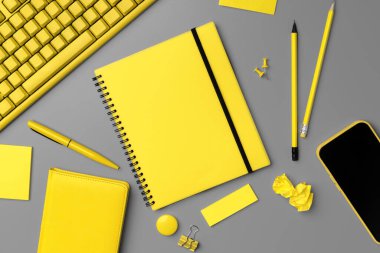 Gri arkaplan üzerinde akıllı telefon ve kalem olan sarı not defteri