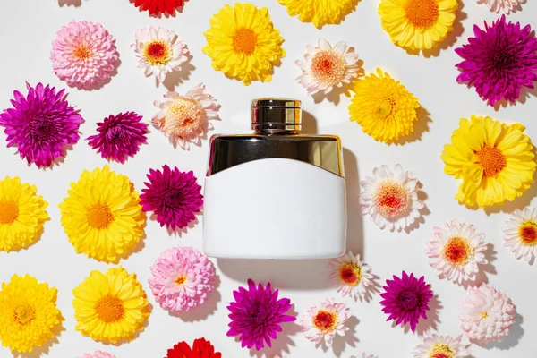 Perfume bottle for women in flower buds — Stock Photo, Image