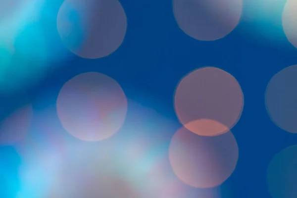 Homályos koszorú bokeh fények kék háttér — Stock Fotó