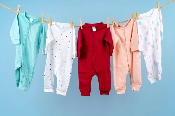 Cute toddler colorful clothing hang on a rope