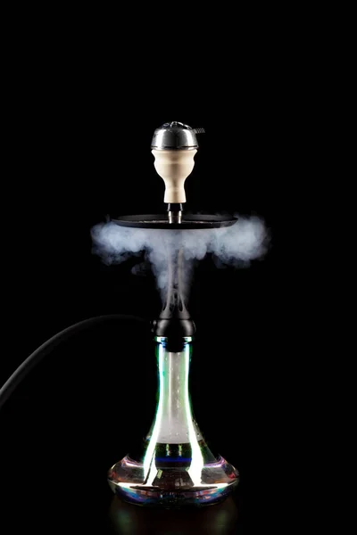 Smoking hookah on black background with color fog — Stock Photo, Image