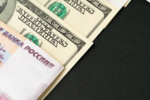 US Dollar and Russian Ruble banknotes close — стокове фото