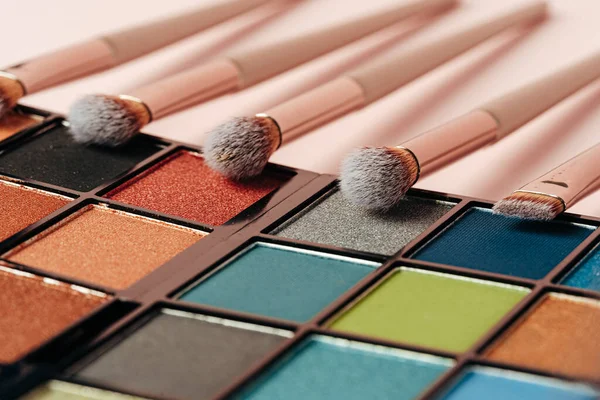 Make-up palette and brushes. Professional eyeshadow palette.