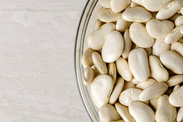 Beans in bowl on the table, close up. — Stock Photo, Image