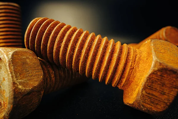 Old rusty bolt on grey background macro Royalty Free Stock Images