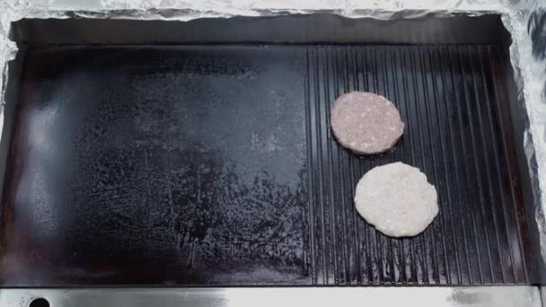 Burger patty frying on professional grill close up — Stock Video