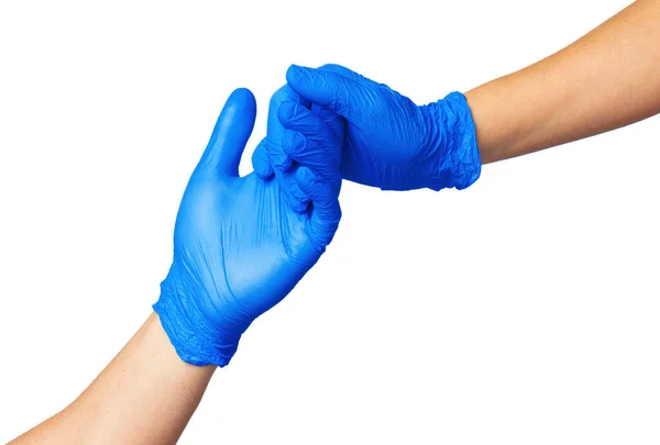 Un apretón de manos con guantes azules, concepto de ayuda. Higiene personal durante una pandemia —  Fotos de Stock