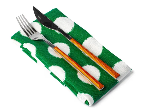Conjunto de garfo e faca na toalha. Isolado sobre fundo branco. — Fotografia de Stock