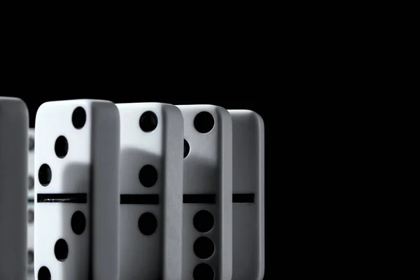 Dominoes standing in a row on black background — Stock Photo, Image