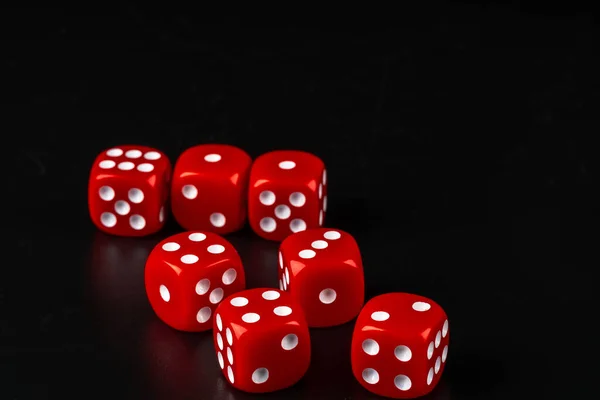 Group of dice close up on dark black background — Stock Photo, Image