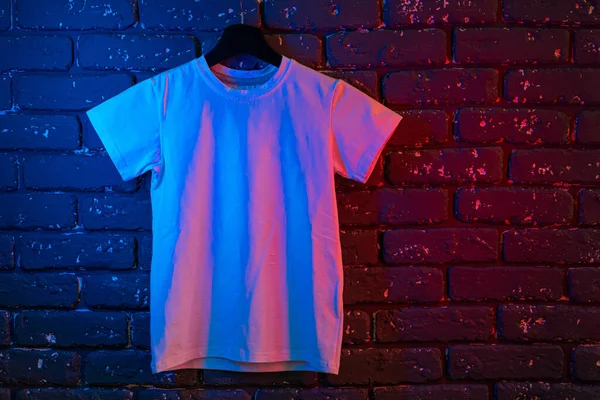 White color unisex t-shirt in neon light