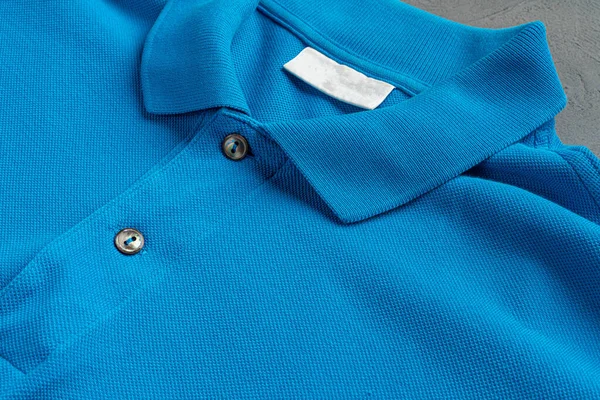 Blue cotton polo t-shirt texture close up