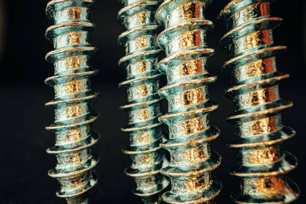 Many metal screws on concrete close up — Stock Photo, Image