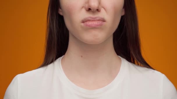 Close up of a woman closing nose bacause of a bad smell — Stock Video