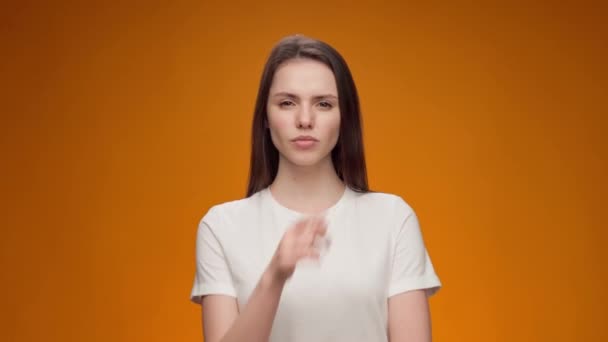 Young woman thinking about her problem, came up with the idea, against yellow background — Stock Video