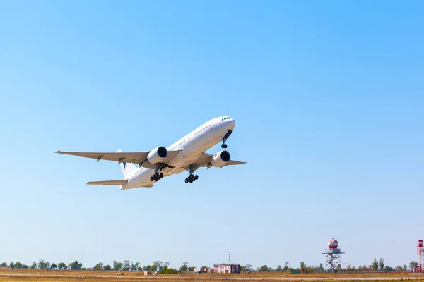 Passenger plane takes off from runway in airport