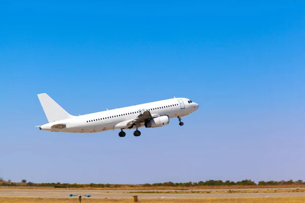 Passenger plane takes off from runway in airport