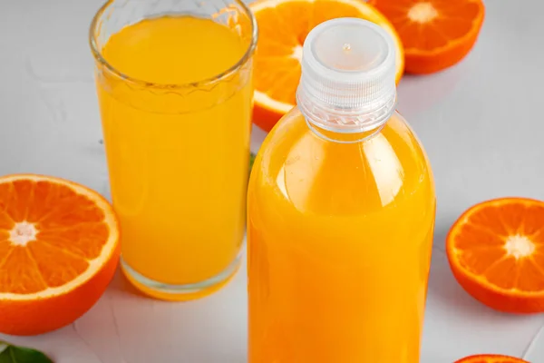 Orange juice cup on table close up