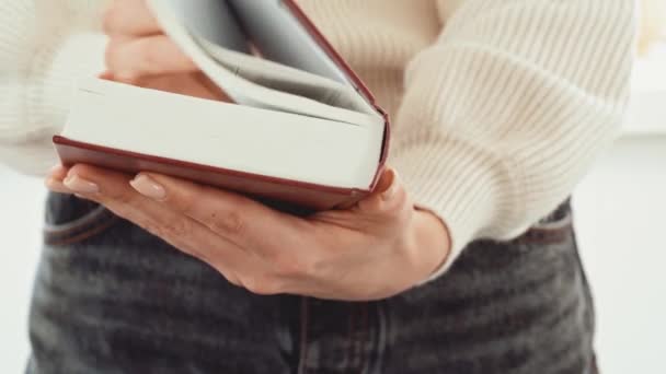 Close up of female hands turning pages of a book — Stock Video