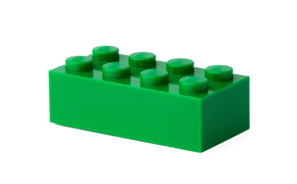 Green plastic building block isolated on white — Stock Photo, Image