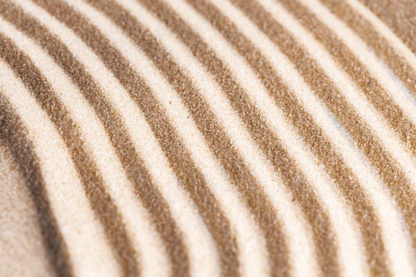 Zen patroon in geel zand, close up. — Stockfoto