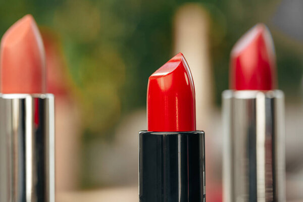 New red lipstick on vanity table close up