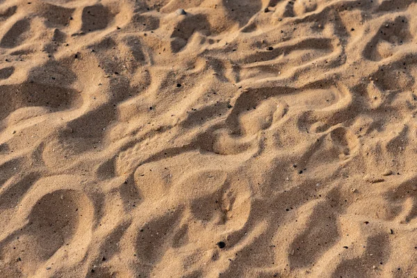 Mooi natuurlijk zand van strand achtergrond bij zonsondergang — Stockfoto