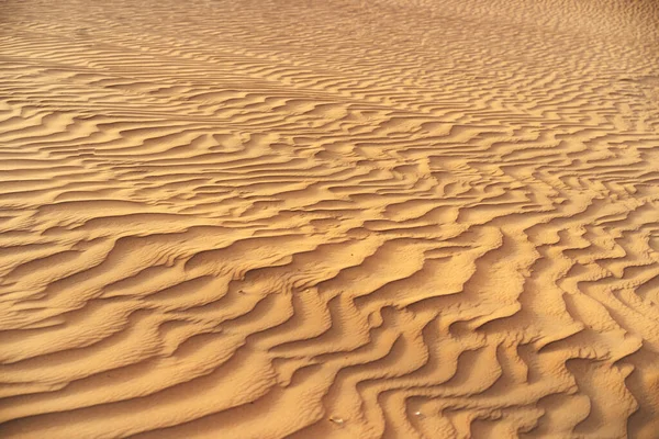 Falisty piasek tekstury w Dubaju pustyni zbliżyć — Zdjęcie stockowe