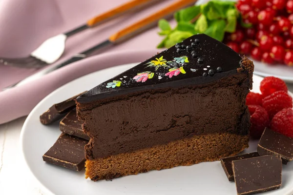 Piece of chocolate cake on table close up — Stock Photo, Image