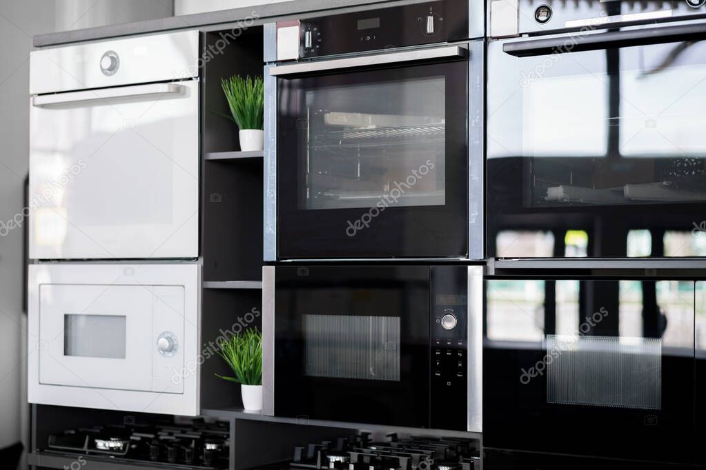Electrical ovens, home appliances in the store..