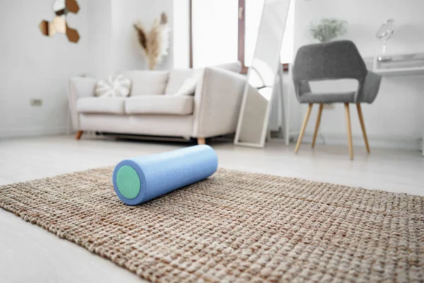 Sport massage roll on a mat indoors — Stock Photo, Image