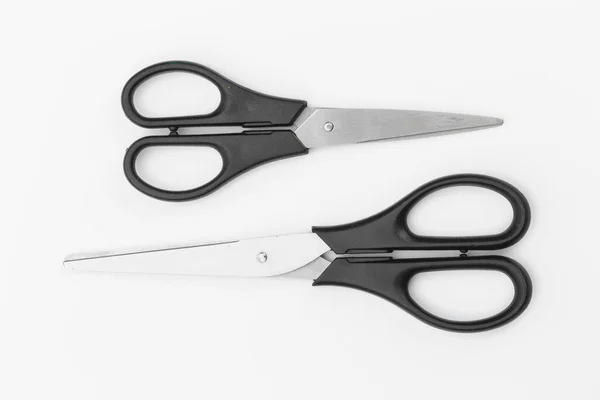 Two black scissors isolated on white background — Stock Photo, Image