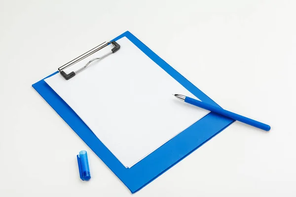 Blue clipboard on office table, top view, flat lay — Stock Photo, Image