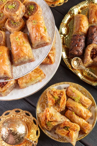 Baklava with pistachio. turkish traditional delight on a dark wood background — Stock Photo, Image