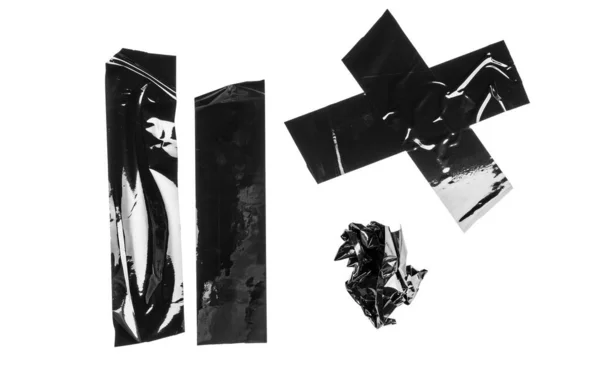 Vrid olika storlek svart klibbig tejp, självhäftande bitar — Stockfoto
