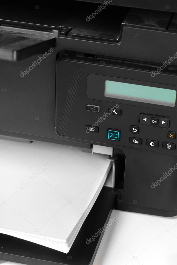 Close up of printer printing documents